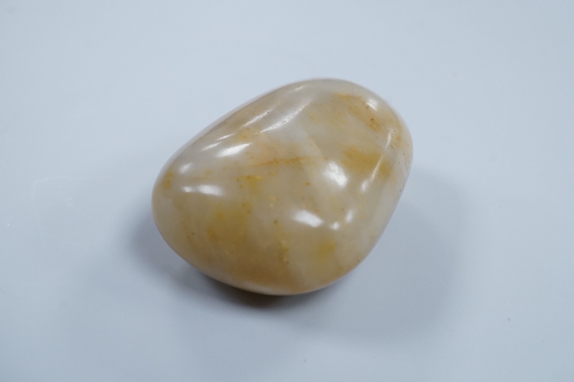 A 19th century Chinese white and russet jade pebble snuff bottle, 5.5cm in length